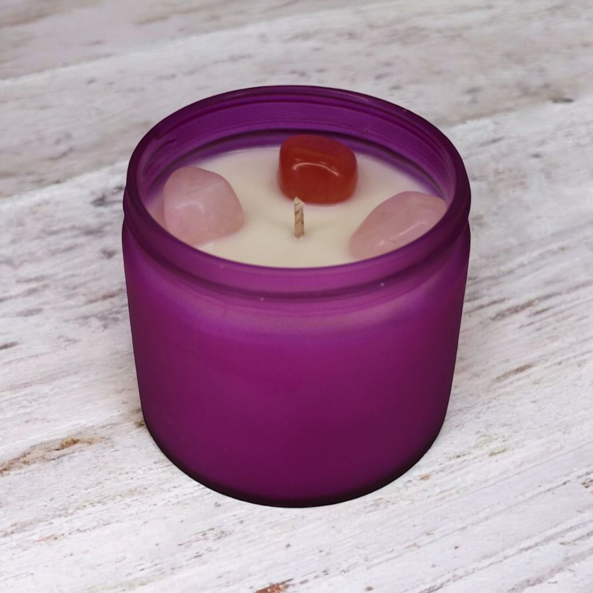 Handmade Compassion Candle with rose quartz and cherry quartz crystals, rose scent, in a glass jar by Whispering Daisies.