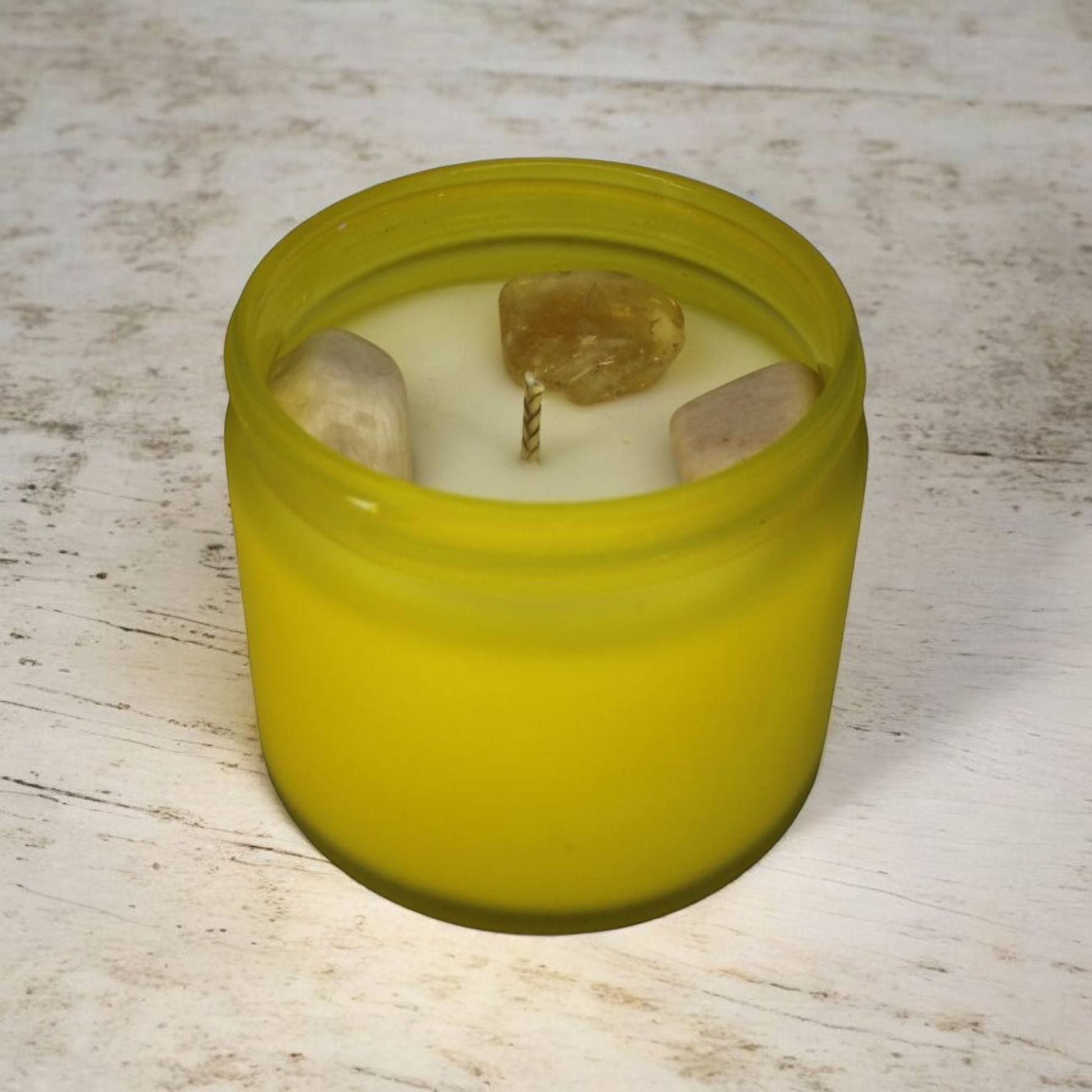 Empowerment Candle featuring citrine and moonstone crystals, citrus and floral fragrance, artisan-made in North Devon.