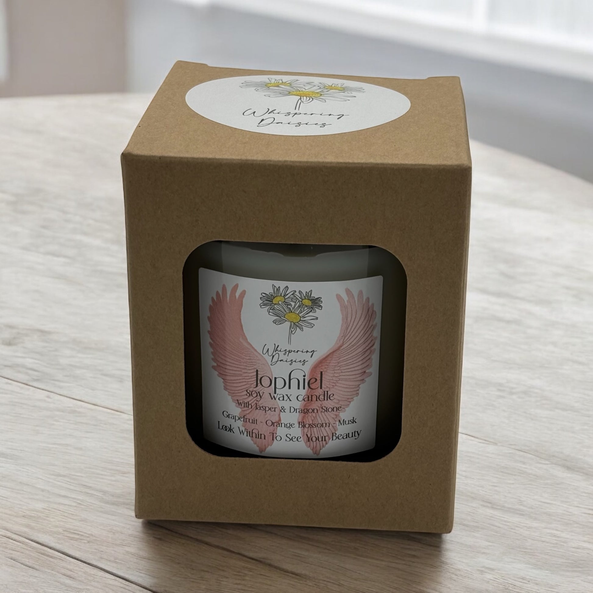 Jophiel Angel Candle in a clear glass jar, topped with jasper and dragon stone crystals, handmade soy candle from Whispering Daisies in North Devon.