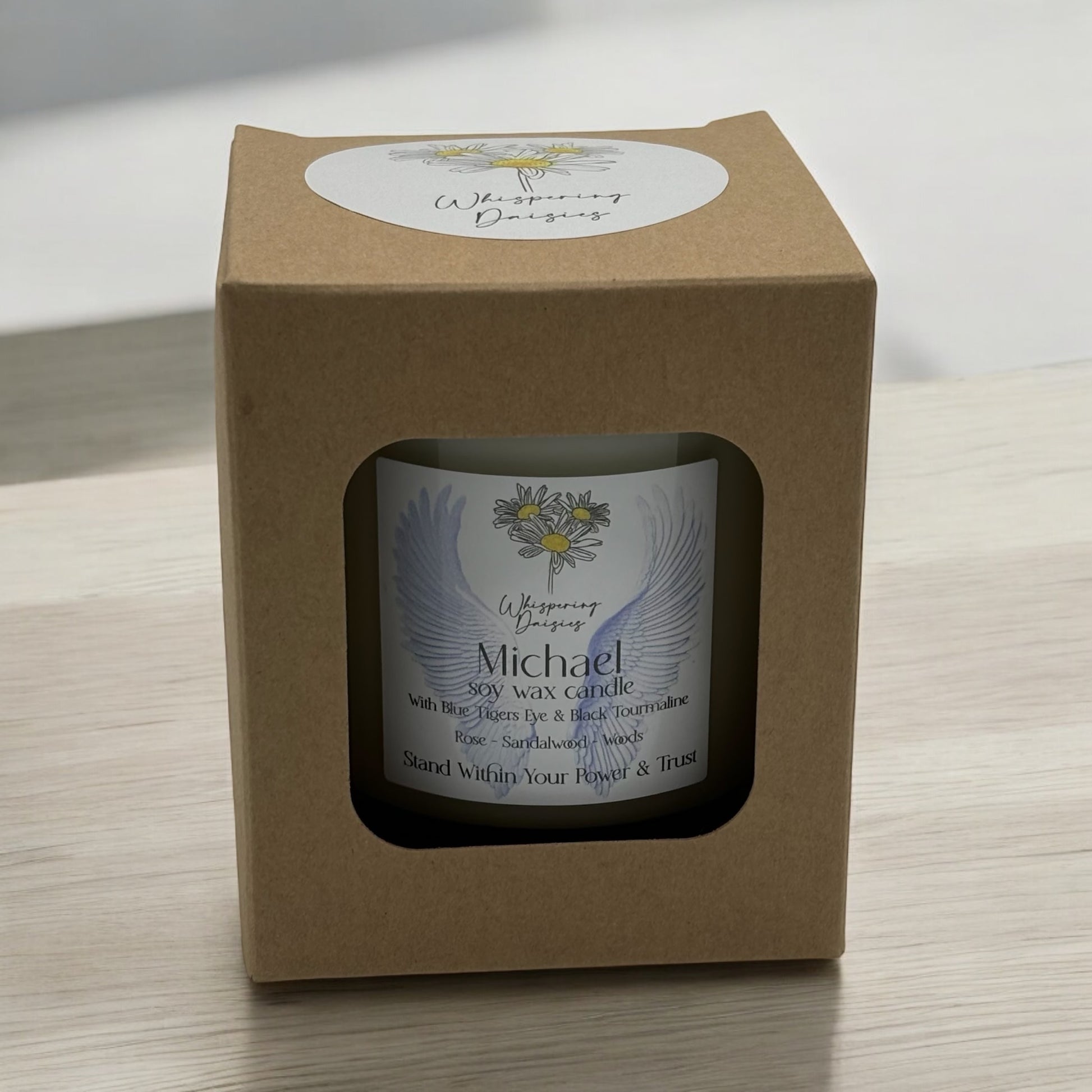 Michael Angel Candle in a clear glass jar, topped with blue tiger’s eye and black tourmaline crystals, handmade soy candle from Whispering Daisies in North Devon.