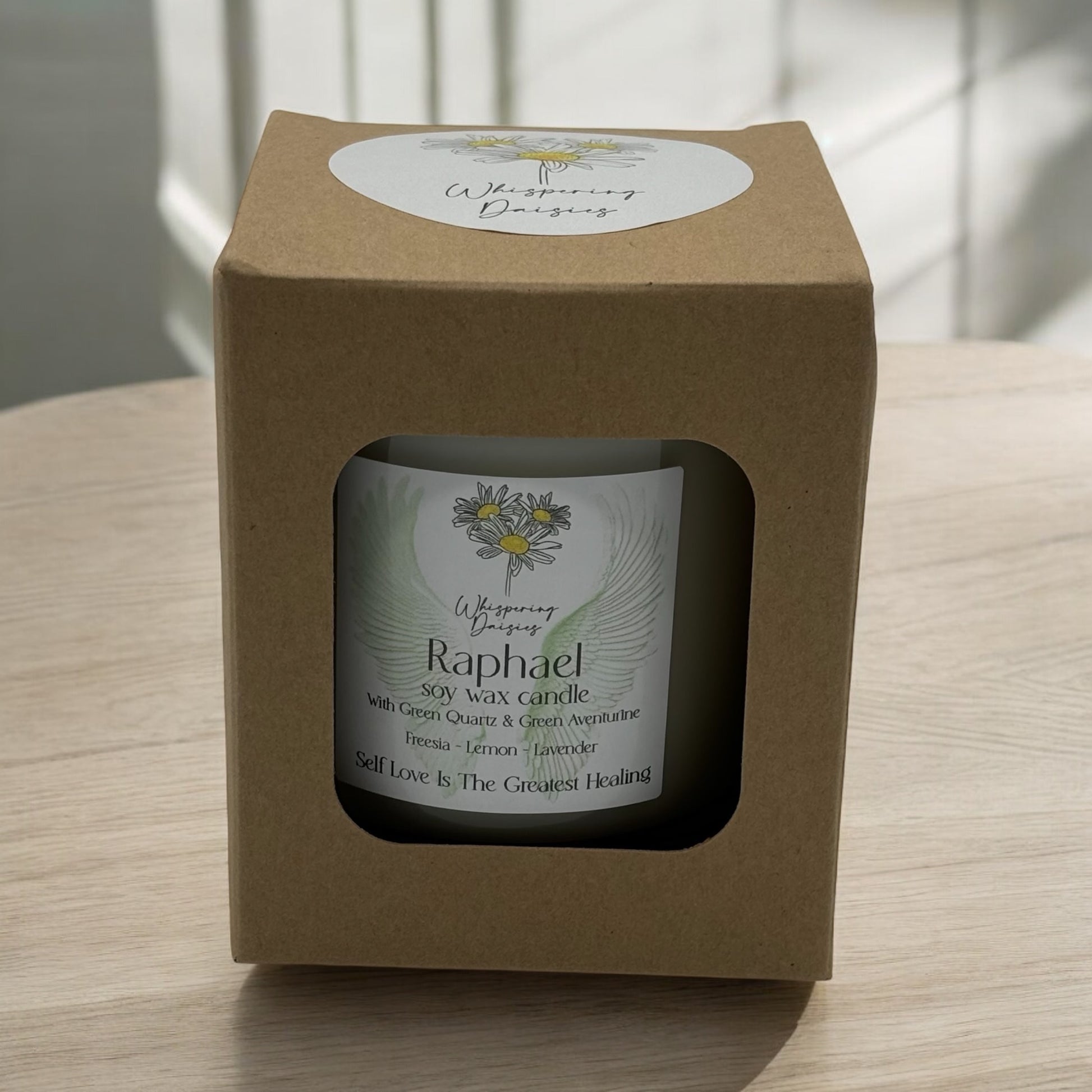 Raphael Angel Candle in a clear glass jar, topped with green quartz and green aventurine crystals, handmade soy candle from Whispering Daisies in North Devon.