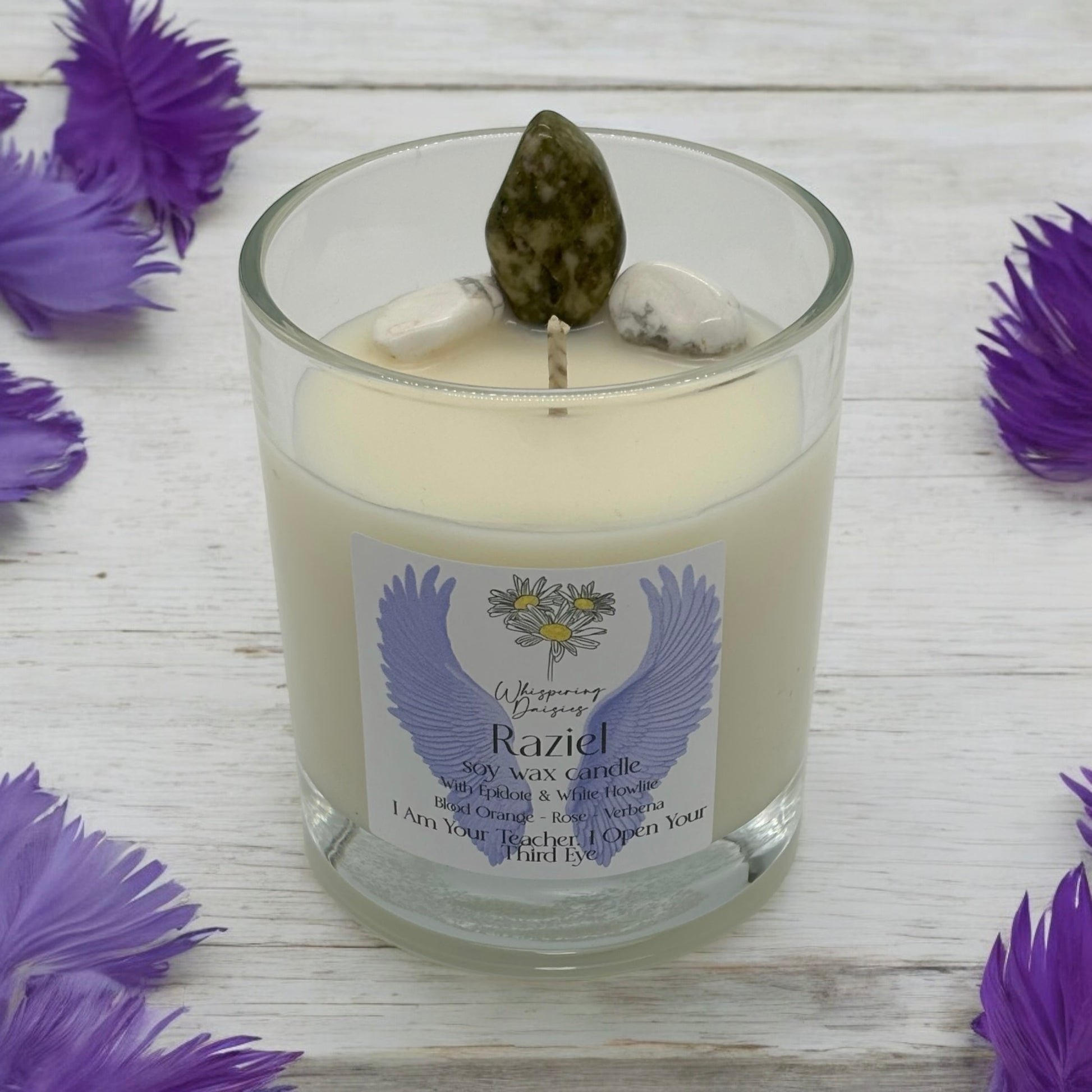 Raziel Angel Candle in a clear glass jar, topped with epidote and white howlite crystals, handmade soy candle from Whispering Daisies in North Devon.
