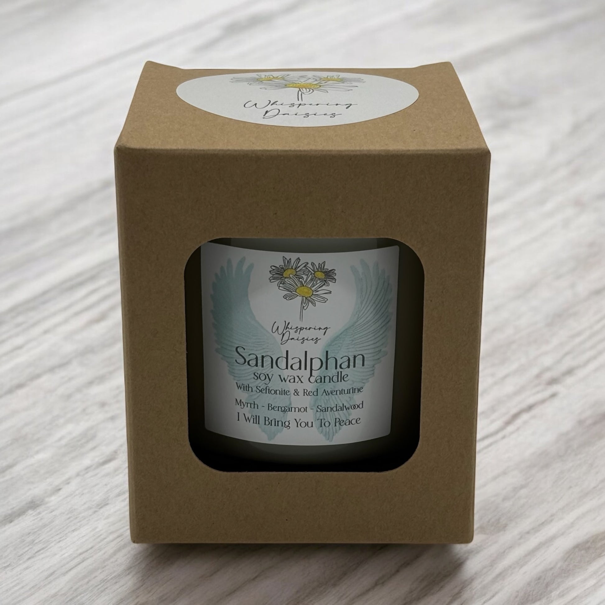 Sandalphon Angel Candle in a clear glass jar, topped with seftonite and red aventurine crystals, handmade soy candle from Whispering Daisies in North Devon.