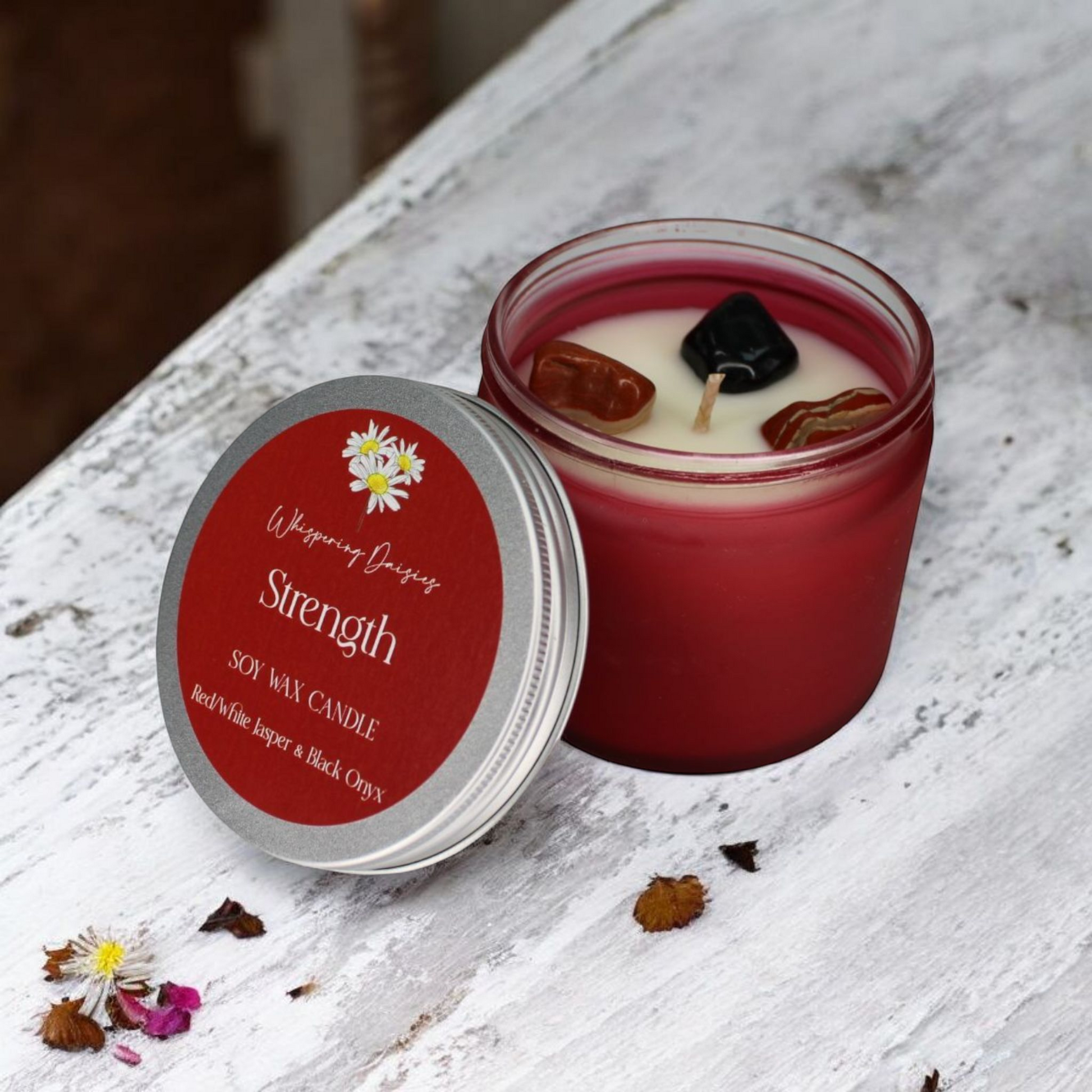 Strength Candle with black onyx and red and white jasper crystals, citrus and woody scent, handmade by Whispering Daisies.
