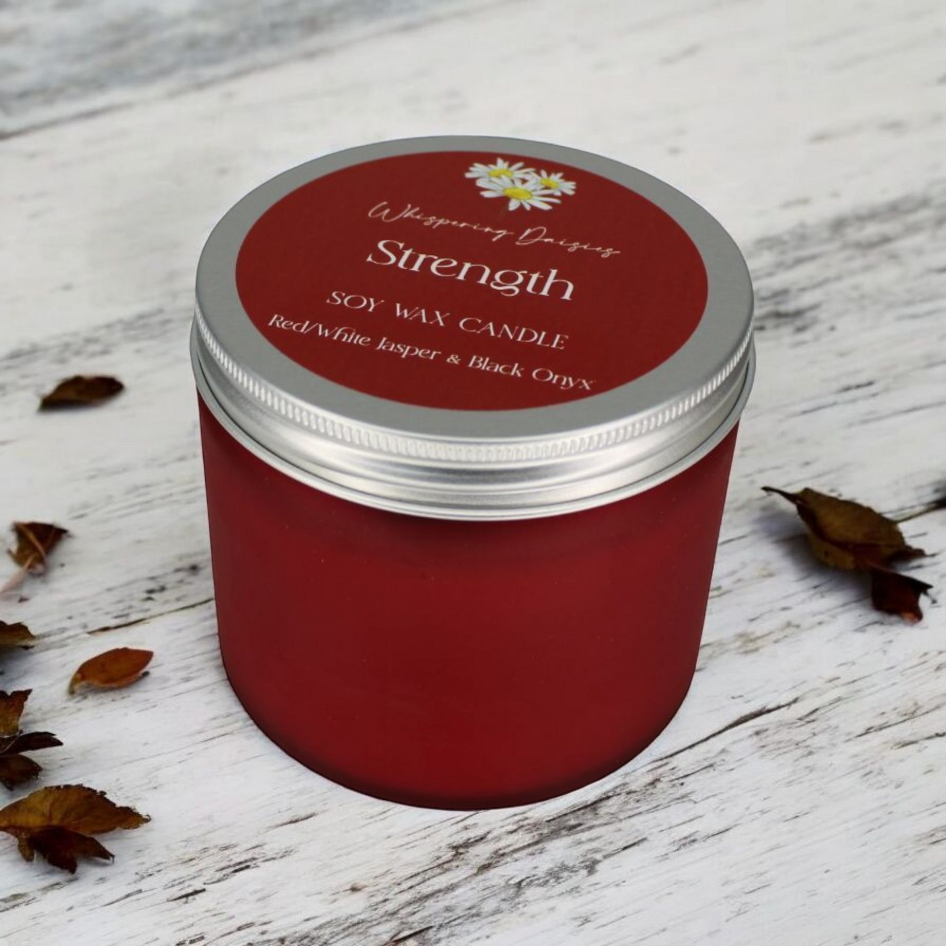 Strength Candle with black onyx and red and white jasper crystals, citrus and woody scent, handmade by Whispering Daisies.