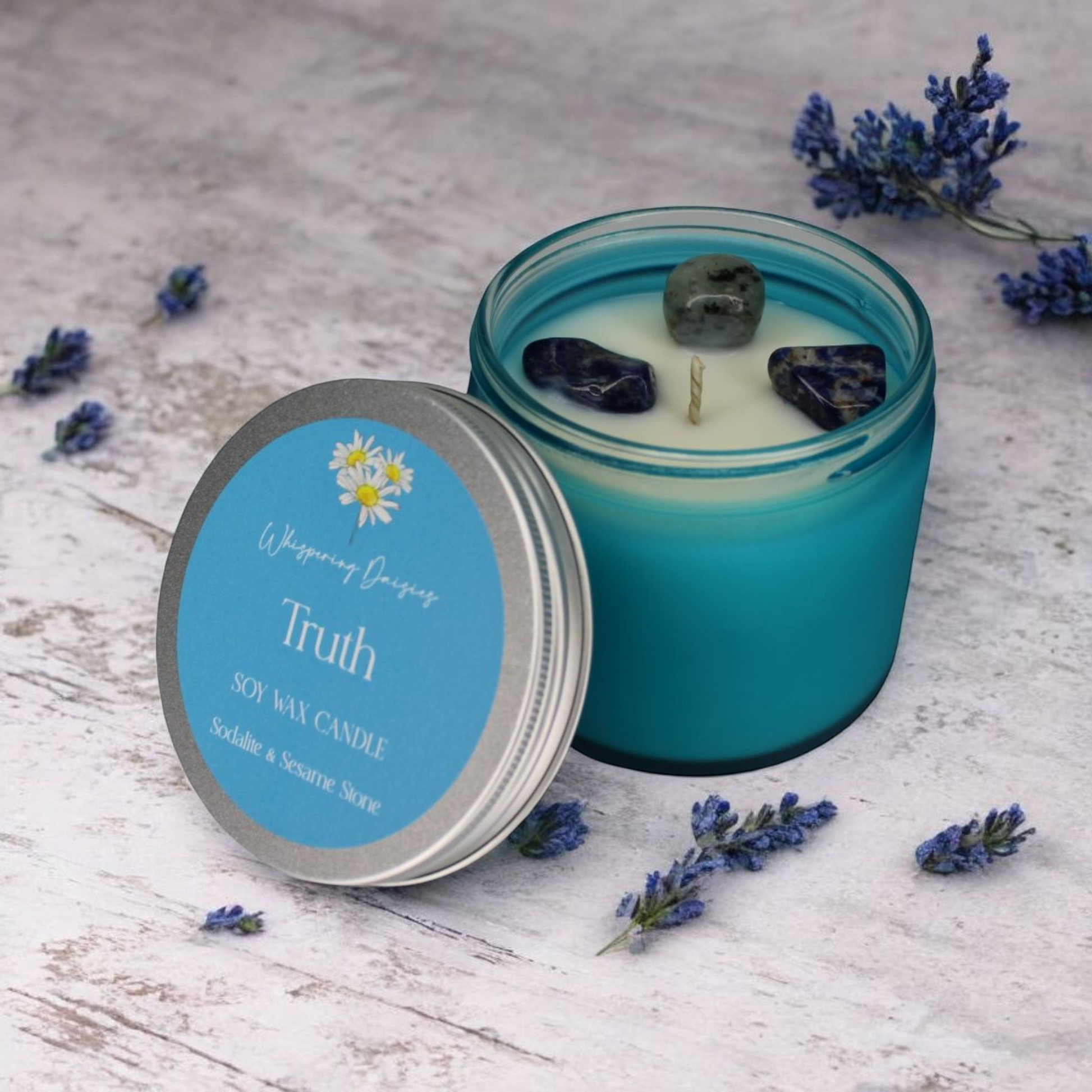 Truth Candle featuring sesame stone and sodalite crystals, aromatic and marine fragrance, handcrafted in North Devon.