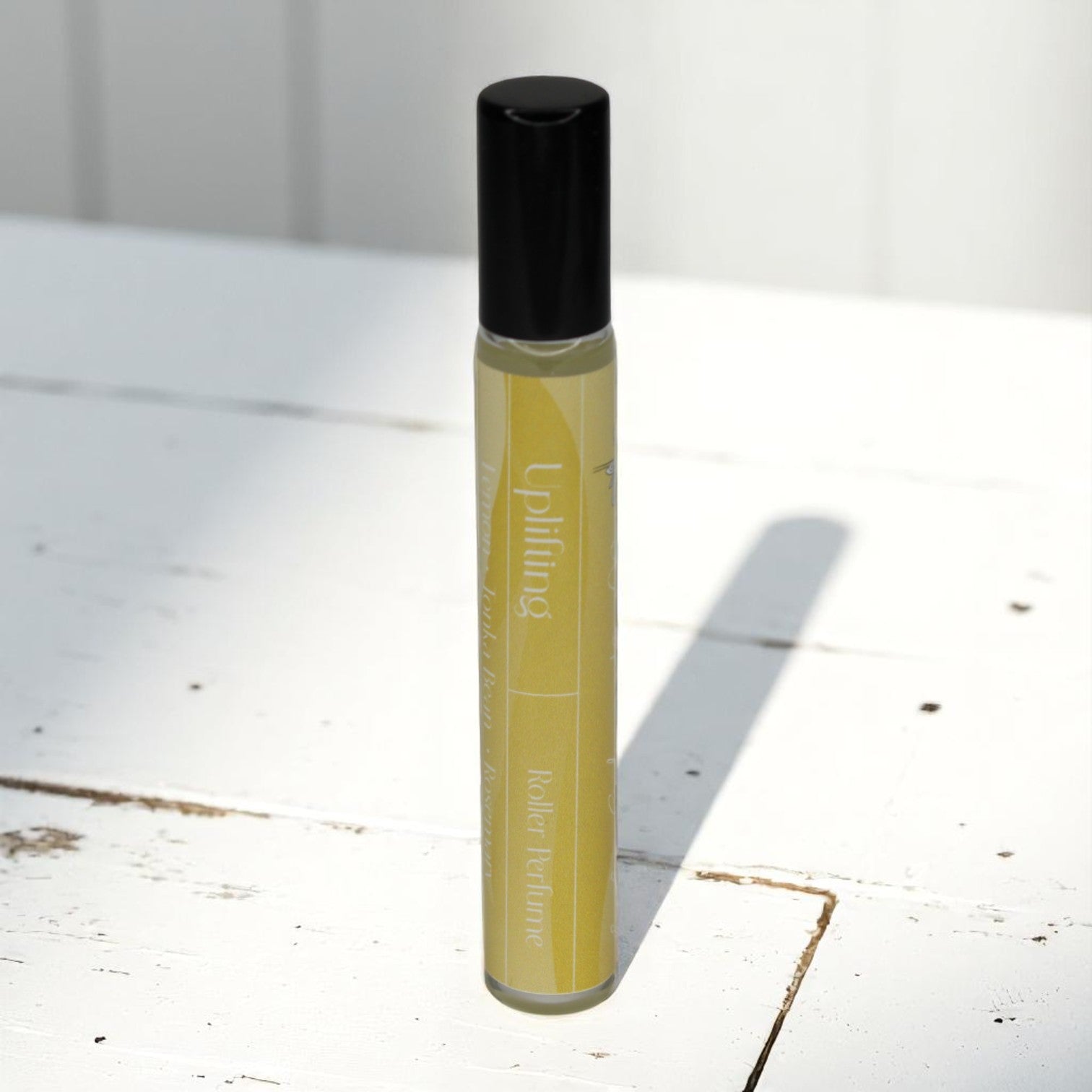uplifting mood enhancing roller perfume  by whispering daisies