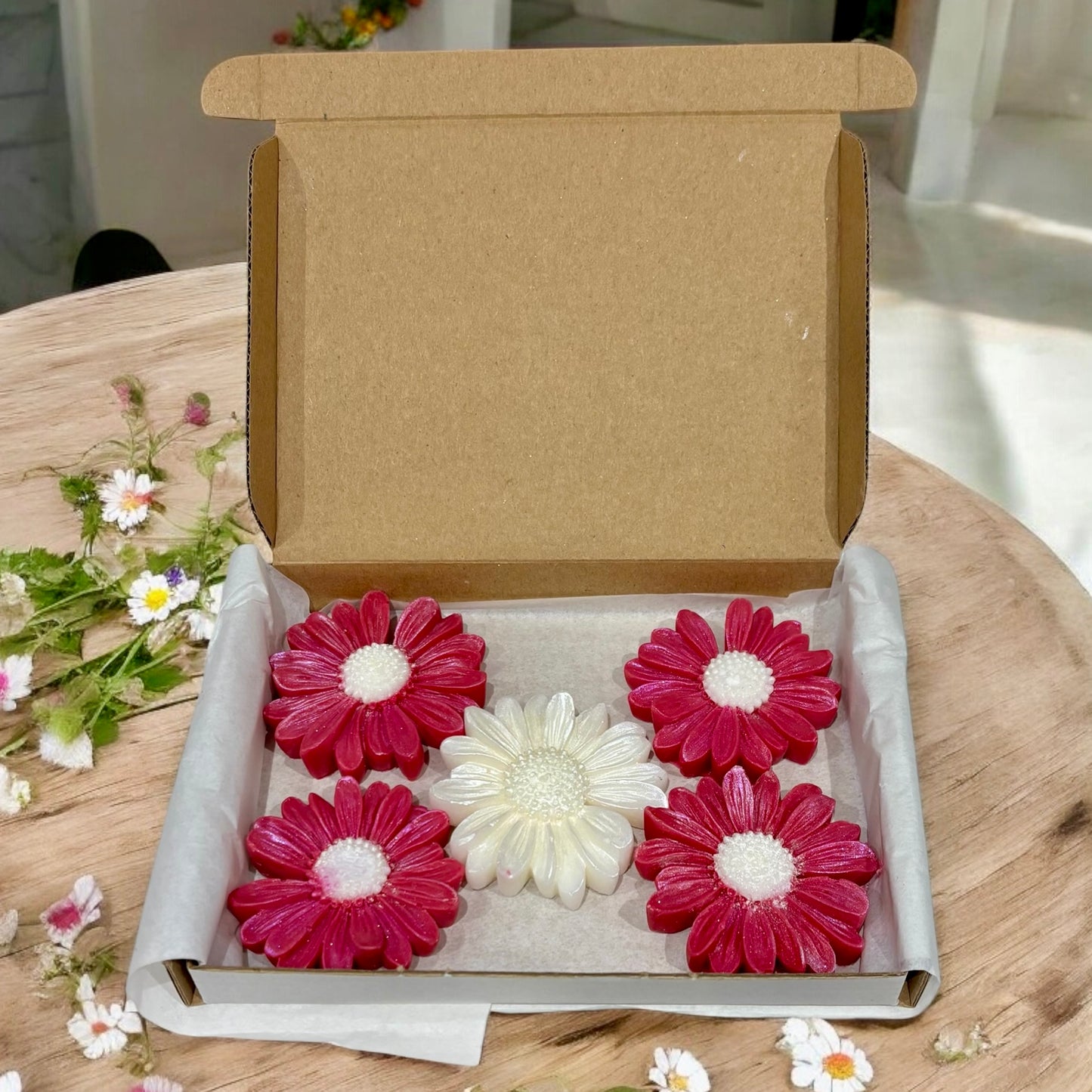 Compassion Daisy-Shaped Wax Melt Box of 5, handmade rose-scented wax melts by Whispering Daisies, wrapped in white paper.