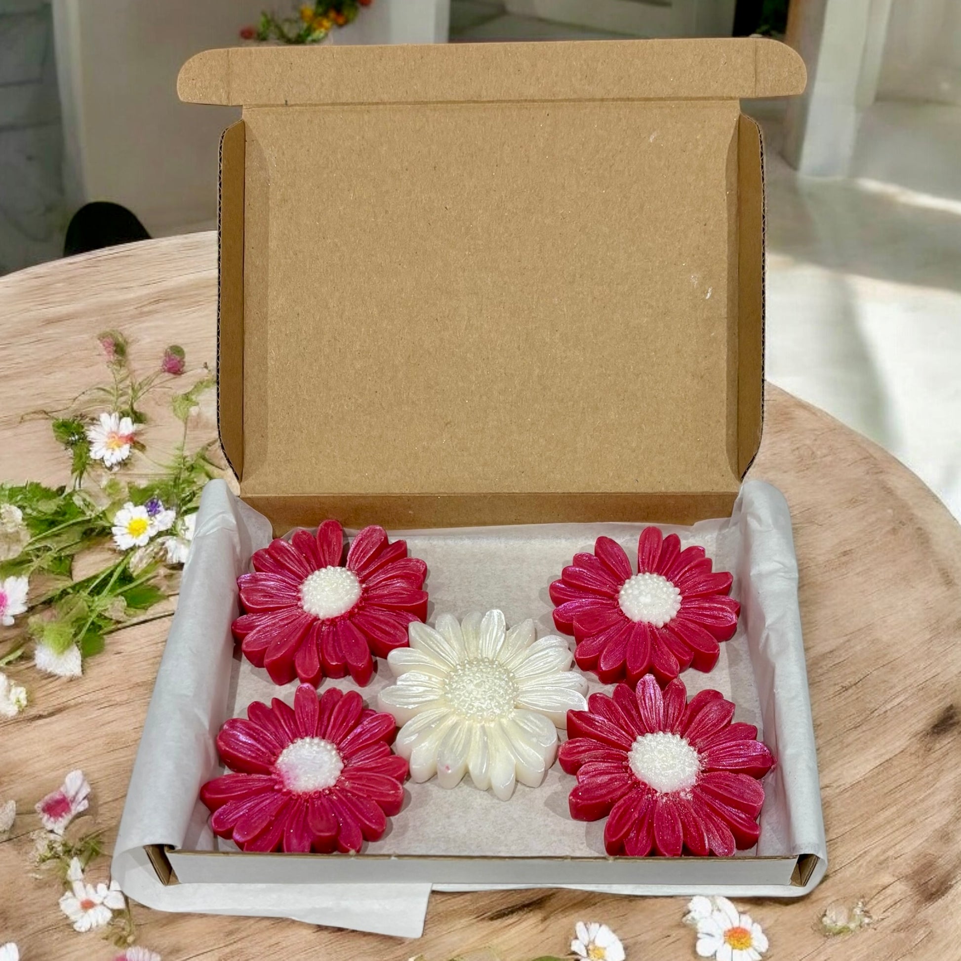 Compassion Daisy-Shaped Wax Melt Box of 5, handmade rose-scented wax melts by Whispering Daisies, wrapped in white paper.