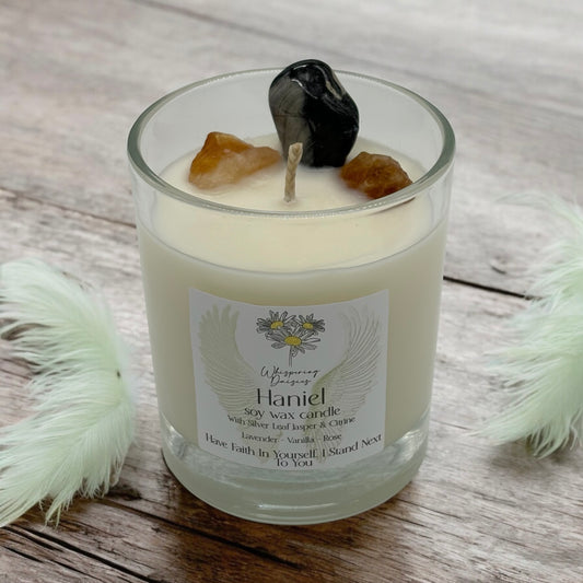Haniel Angel Candle in a clear glass jar, topped with silver lead jasper and citrine crystals, handmade soy candle from Whispering Daisies in North Devon.